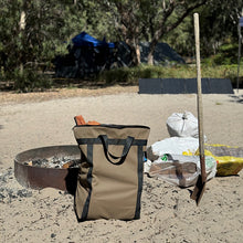 Load image into Gallery viewer, Tough Canvas firewood carrier next to a fire