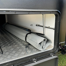 Load image into Gallery viewer, Underkover anti-flap bag in caravan storage boot