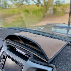 brown colour dash organiser on Hilux dash mat