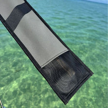 Load image into Gallery viewer, A close-up of a gray and black strap or sleeve showing mesh drainage at base