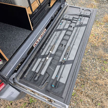 Load image into Gallery viewer, 2 Rod sleeves showing fishing rods on top of them on a tail gate
