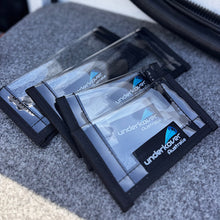 Load image into Gallery viewer, Four transparent lure cases with 'undercover Australia' branding on a boat deck 