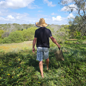 man walking holding canvas bag