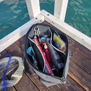 fishing bag open with tackle inside