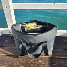 Load image into Gallery viewer, tackle bag on pier near water