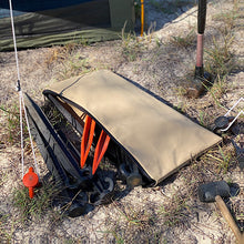 Load image into Gallery viewer, Canvas bag with sand pegs spilling out of it