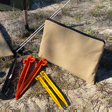 Load image into Gallery viewer, Sand peg bag with sand pegs on the ground