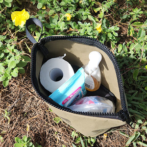 unzipped canvas bag showing items inside