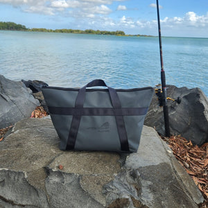 tackle bag on rock at the beach