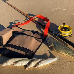 Wading Bag on sand with fish