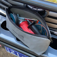 Load image into Gallery viewer, Canvas bag sitting on the front of a car with a grinder in it