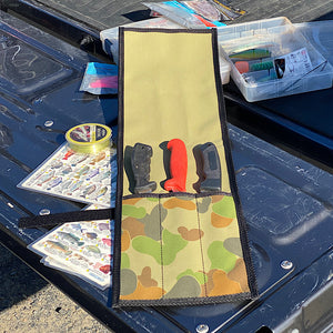 Knife roll with 3 knives slotted inside