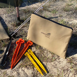 pegs in front of canvas bag